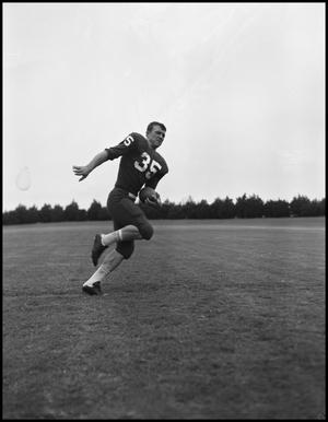 Primary view of object titled '[Football Player No. 35 Running with the Ball, September 1962]'.