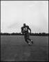 Primary view of [Football Player No. 42 Running with a Football, September 1962]
