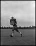 Photograph: [Football Player No. 82 Running with a Ball, September 1962]