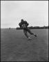 Photograph: Football Player No. 42 Running with a Football, September 1962]