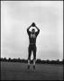 Photograph: [Football Player No. 86 Catching a Football, September 1962]