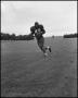 Photograph: [Football Player No. 42 Running with the Ball, September 1962]