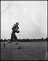 Photograph: [Football Player No. 83 Running with a Ball, September 1962]