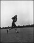Photograph: [Football Player No. 83 Running with a Football, September 1962]