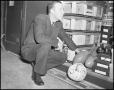 Photograph: [Man in equipment room]