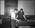 Photograph: [Two Men Typesetting at the Printshop]