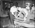 Thumbnail image of item number 1 in: '[People canning food at NTSTC canning plant]'.