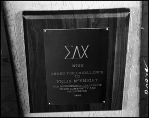 Primary view of object titled '[Photograph of an award from Sigma Delta Chi]'.