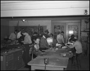 Primary view of object titled '[Students working in metal shop class, 1942]'.