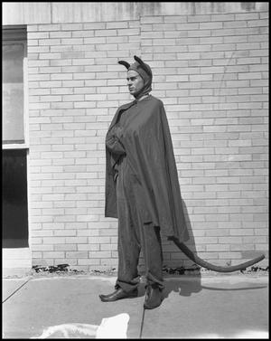 Primary view of object titled '[Man in a Devil Costume]'.