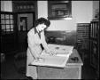 Thumbnail image of item number 1 in: '[Woman working in Campus Chat office]'.