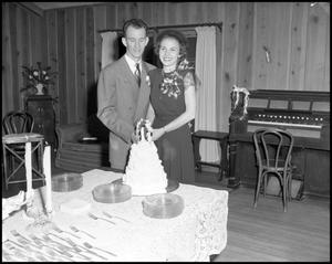 Primary view of object titled '[Couple with Wedding Cake]'.