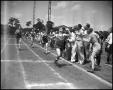 Thumbnail image of item number 1 in: '[Track Team Member at Finish Line]'.