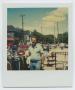 Primary view of [Portrait of One Man Shopping Outdoors]