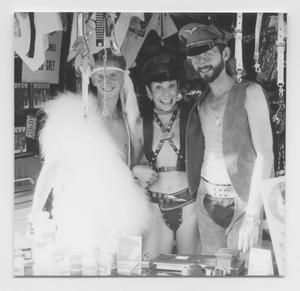 Primary view of object titled '[One Woman and Two Men in Halloween Costumes]'.