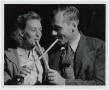 Thumbnail image of item number 1 in: '[Couple Sampling Molasses with Sop Sticks]'.