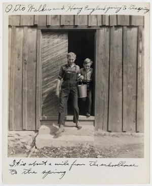 Primary view of object titled '[Otto Walker and Harry England heading to the spring for water]'.