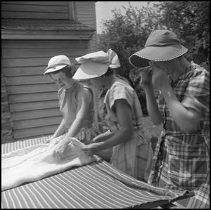 Primary view of object titled '[Women quilting outdoors]'.