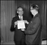 Photograph: [President J. C. Matthews holding a check, 3]