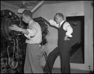 Primary view of object titled '[Two Men in a Projection Booth]'.