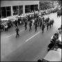 Primary view of [AFROTC members march in the Homcoming Parade November 5, 1966]