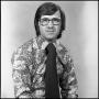 Photograph: [Unidentified man wearing glasses and a printed shirt, 5]