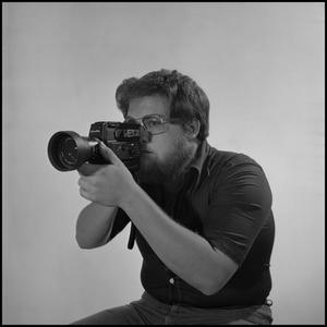 Primary view of object titled '[Filmmaker Lewis Abernathy with camera, 3]'.
