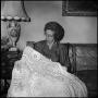 Photograph: [Unidentified alumna showing off a blanket, 2]