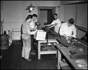 Primary view of object titled '[Students working in a metal shop]'.