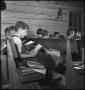 Photograph: [Students reading in school]