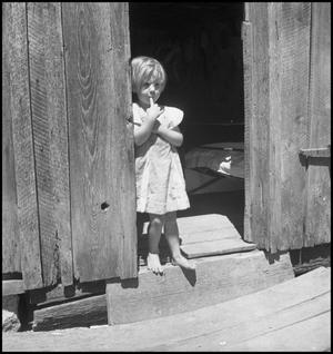 Primary view of object titled '[Little Girl in Doorway Dreaming]'.