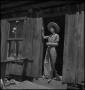 Photograph: [Country Women protecting her property]