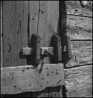 Primary view of object titled '[Secure latch to smokehouse]'.