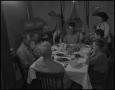 Photograph: [Family at dinner time]