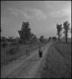 Photograph: [Girl and a Boy Walking to School]