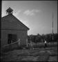Photograph: [Students walking up to school house]