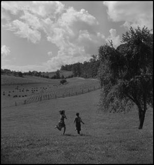 Primary view of object titled '[Kids running across field]'.