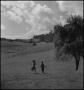 Thumbnail image of item number 1 in: '[Kids running across field]'.
