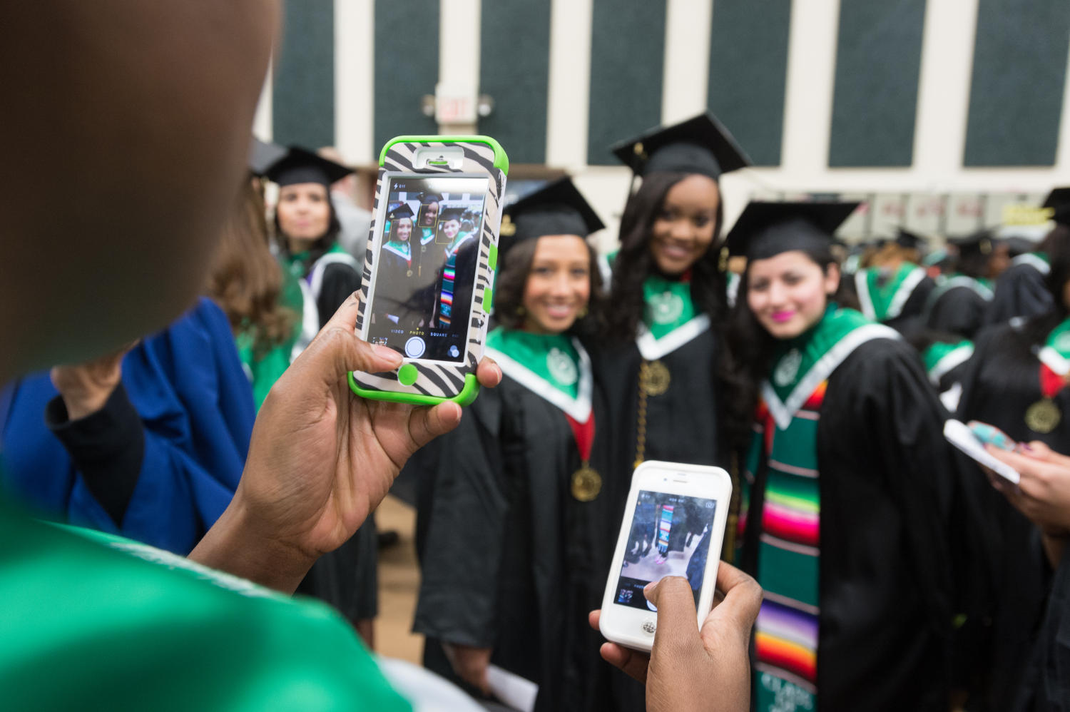 [Students take photographs before UNT Commencement] Side 1 of 1 The
