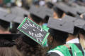 Thumbnail image of item number 1 in: '[Decorated mortarboard at UNT Commencement]'.