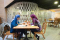 Photograph: [Two students at GAB Coffee Shop]
