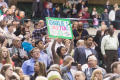 Photograph: [Girl holding sign at UNT Commencement]