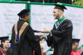 Photograph: [Student receiving diploma]