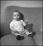 Photograph: [Baby playing with a toy]