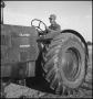 Photograph: [A man on a Oliver 90 tractor, 2]