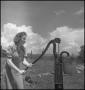 Photograph: [A woman using a water pump, 2]