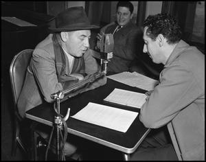 Primary view of object titled '[Two men reading from a script together]'.