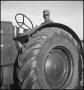 Photograph: [A man on a Oliver 90 tractor, 3]