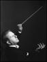 Photograph: [Man conducting with a baton]