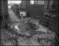 Thumbnail image of item number 1 in: '[Aerial image of a parade in downtown, 2]'.